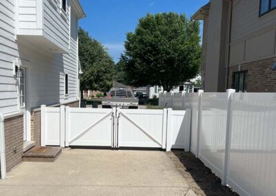 a white vinyl fence