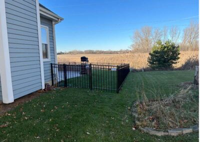 a black aluminum fence