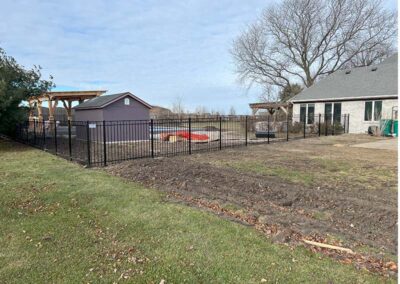 a black aluminum fence