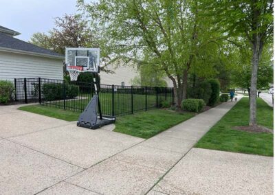 a black aluminum fence