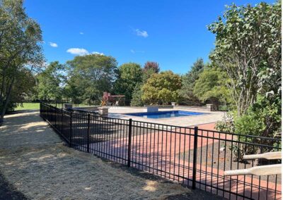 a black aluminum fence