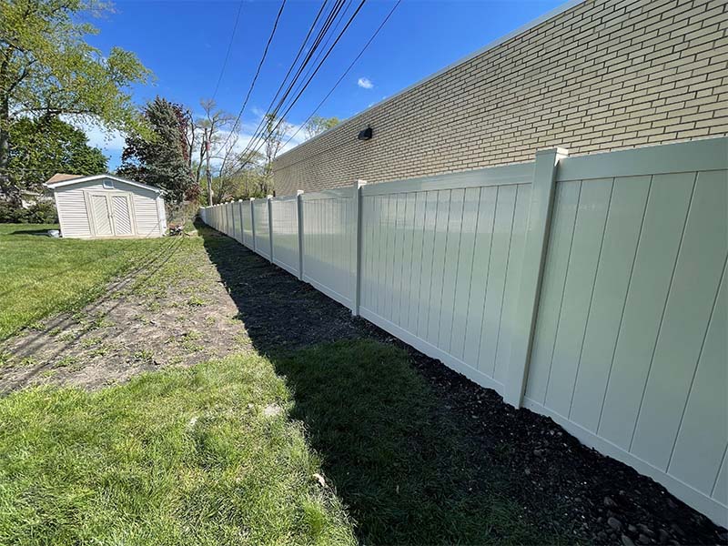 a white vinyl fence